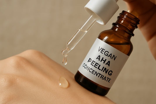 Close-up of a dropper dispensing vegan AHA peeling concentrate onto a clean hand. Alt: Vegan AHA peeling concentrate routine serum dropper for gentle exfoliation.